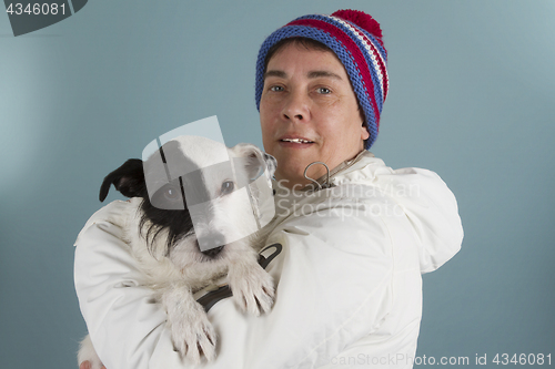 Image of Woman with her little dog. 