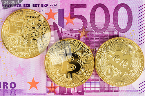 Image of Bitcoins with Euro Banknotes