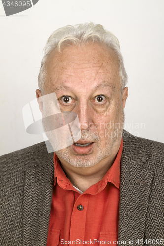 Image of Senior man looking astonished