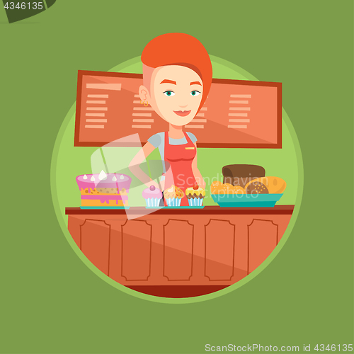 Image of Worker standing behind the counter at the bakery.