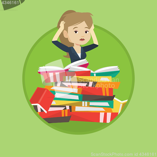 Image of Student sitting in huge pile of books.
