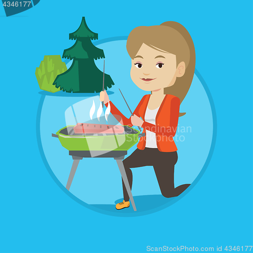 Image of Woman cooking steak on barbecue grill.