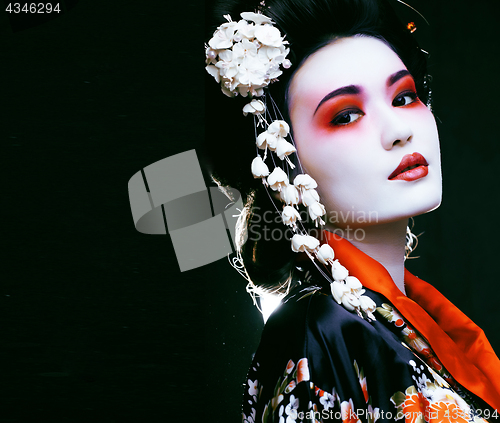 Image of geisha in kimono on black