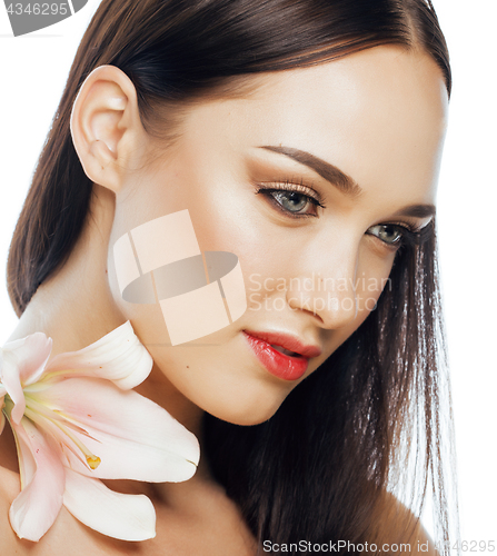 Image of young attractive lady close up with hands on face isolated flower lily brunette spa nude makeup macro