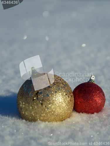 Image of christmas balls decoration in snow