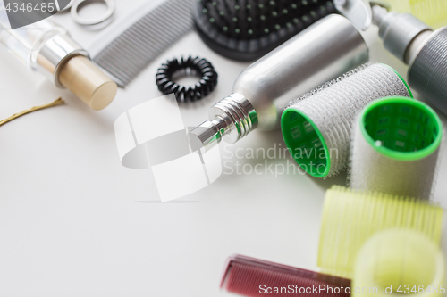 Image of styling sprays, curlers and pins