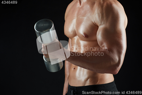 Image of close up of man with dumbbells exercising