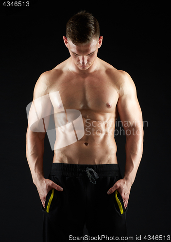 Image of young man or bodybuilder with bare torso