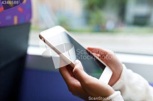 Image of Using mobile phone inside bus