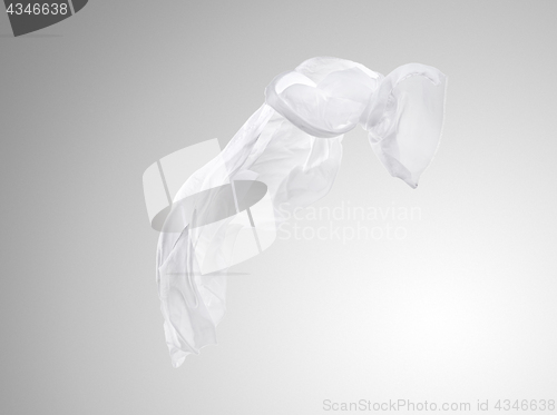 Image of Smooth elegant transparent white cloth separated on gray background.