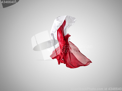 Image of Smooth elegant transparent red and white cloth separated on gray background.