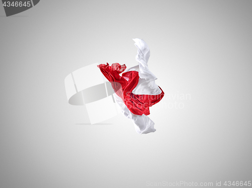 Image of Smooth elegant transparent red and white cloth separated on gray background.