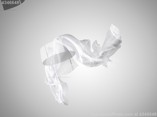 Image of Smooth elegant transparent white cloth separated on gray background.