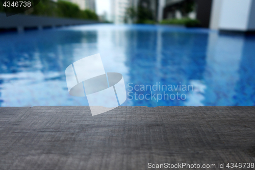 Image of Swimming pool and wooden deck