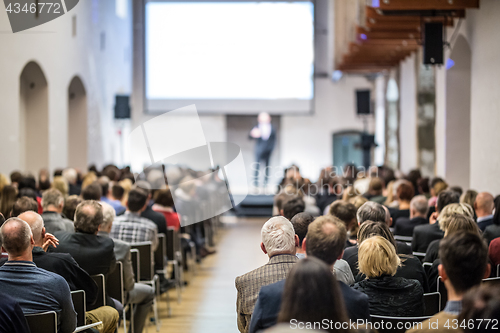 Image of Business speaker giving a talk at business conference event.