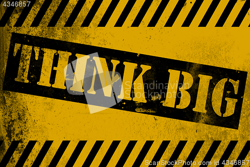 Image of Think big sign yellow with stripes