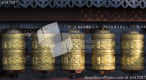 Image of Buddhist prayer wheels rotating in motion