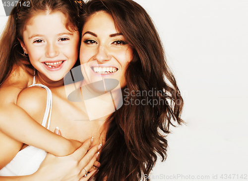 Image of young mother with little cute daughter emotional posing on white