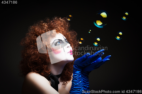 Image of Woman mime with soap bubbles.
