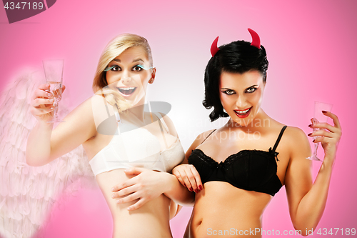 Image of Two Sexy Girls. Angel and devil