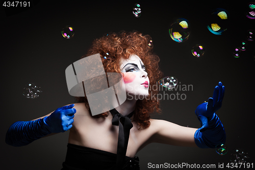 Image of Woman mime with soap bubbles.