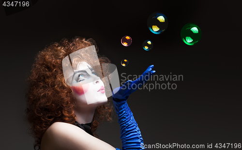 Image of Woman mime with soap bubbles.