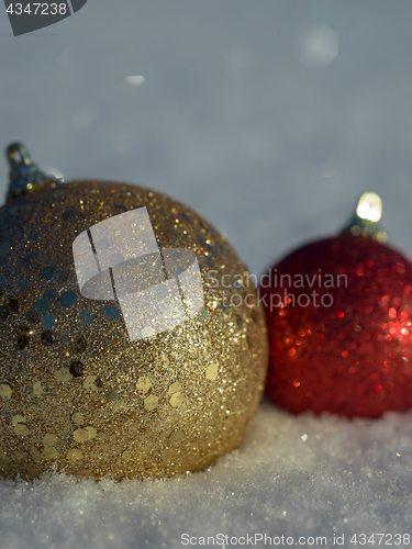 Image of christmas balls decoration in snow