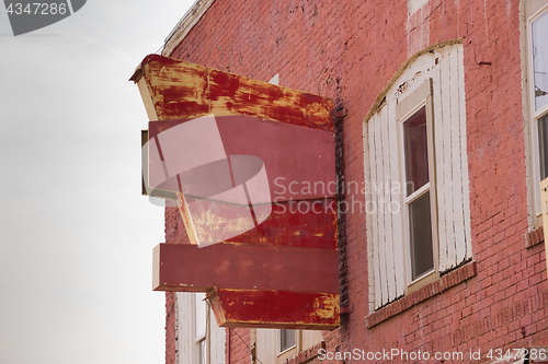 Image of Abandoned Commericial Building Space Worn Out Painted Sign