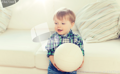 Image of happy little baby boy with ball at home