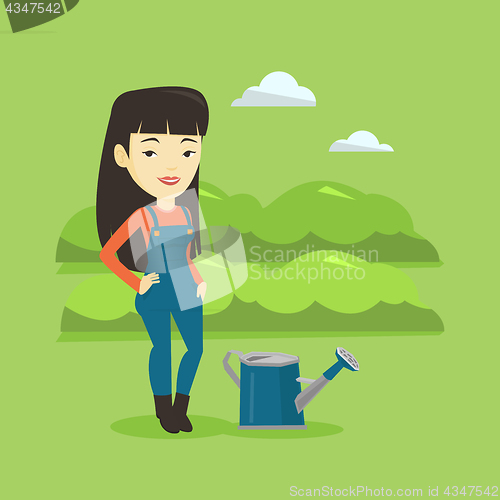 Image of Farmer with watering can at field.