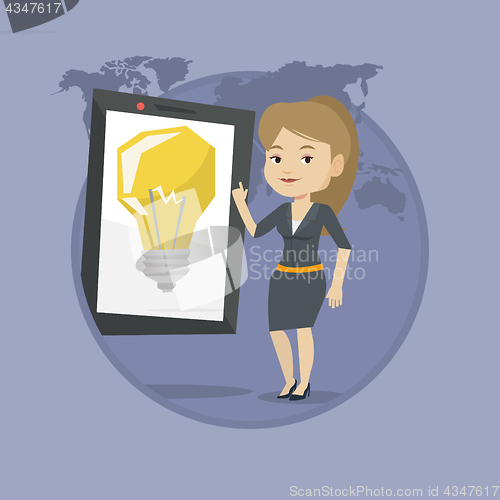 Image of Woman pointing at big tablet computer.