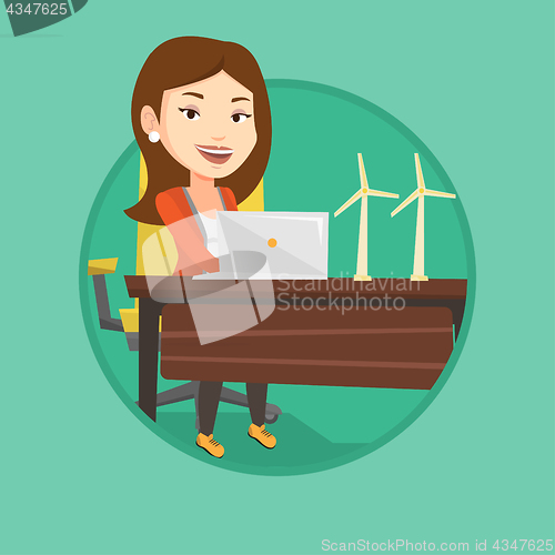 Image of Woman working with model of wind turbines.