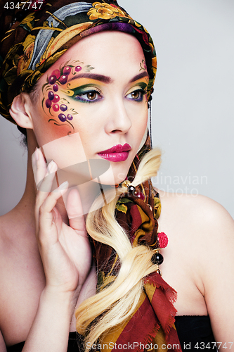 Image of close up portrait of beauty woman with face art