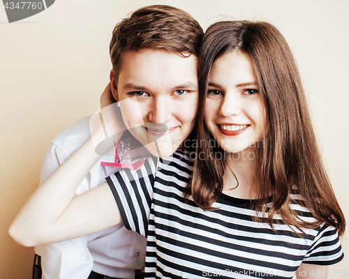 Image of couple of happy smiling teenagers students, warm colors having a