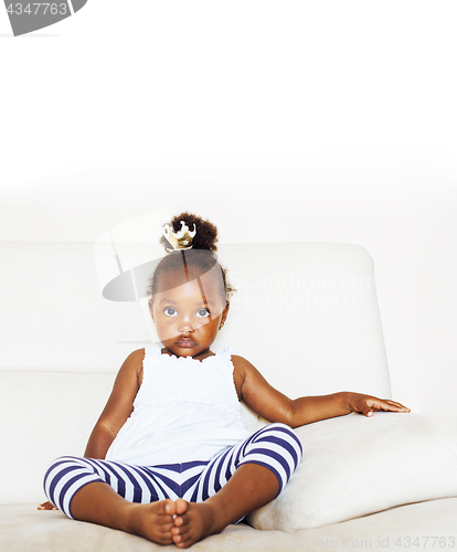 Image of little cute african american girl playing with animal toys at ho