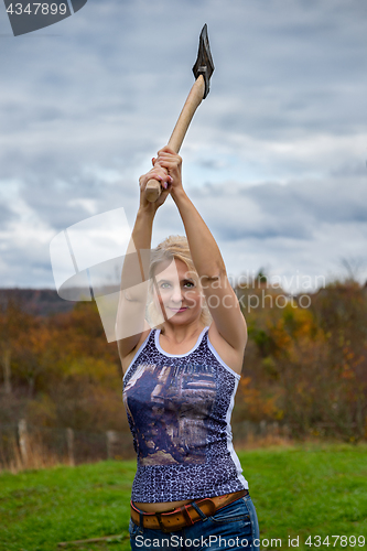 Image of Blonde with axe