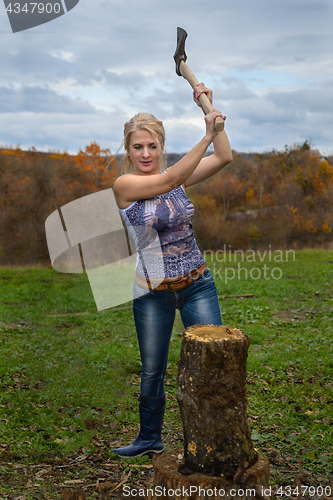 Image of Blonde with axe