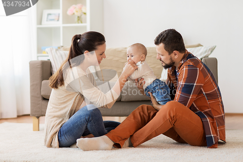 Image of happy family with baby having fun at home