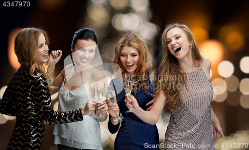 Image of happy women drinking champagne at christmas