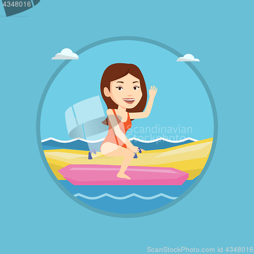 Image of Tourists riding a banana boat vector illustration.