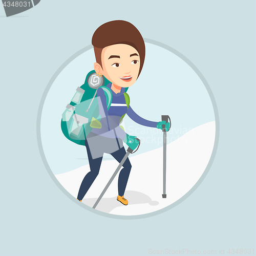 Image of Young mountaneer climbing a snowy ridge.