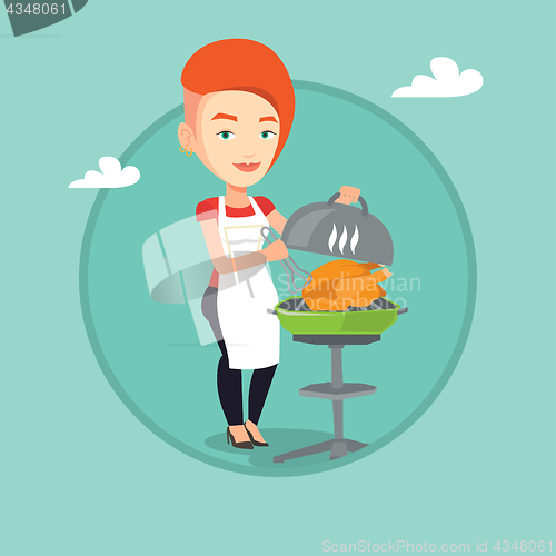 Image of Woman cooking chicken on barbecue grill.