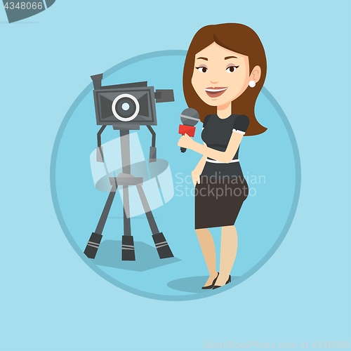 Image of TV reporter with microphone and camera.