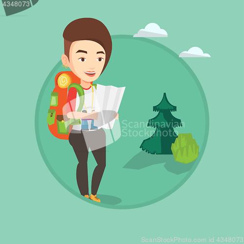 Image of Traveler with backpack looking at map.