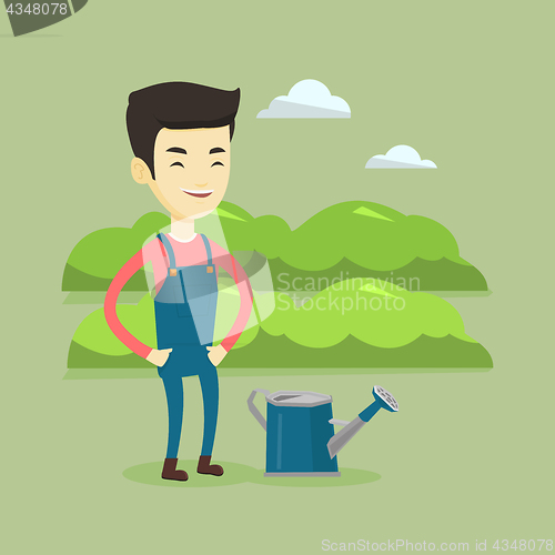 Image of Farmer with watering can at field.