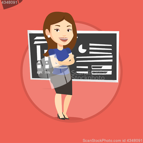 Image of Teacher or student standing in front of chalkboard