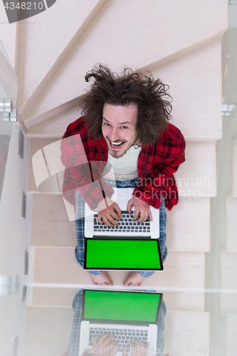 Image of freelancer in bathrobe working from home