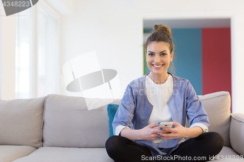 Image of woman using mobile phone