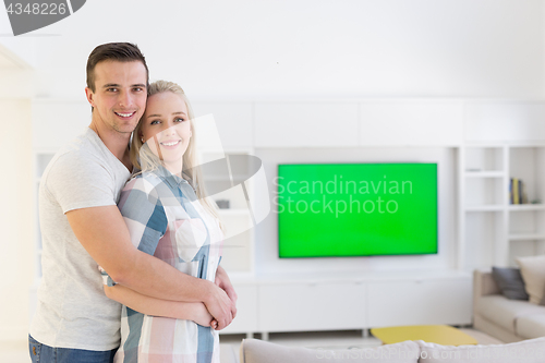 Image of couple hugging in their new home