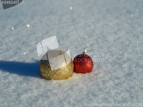 Image of christmas balls decoration in snow